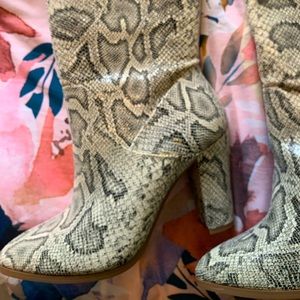 Express over knee faux snake skin boot.Size 7